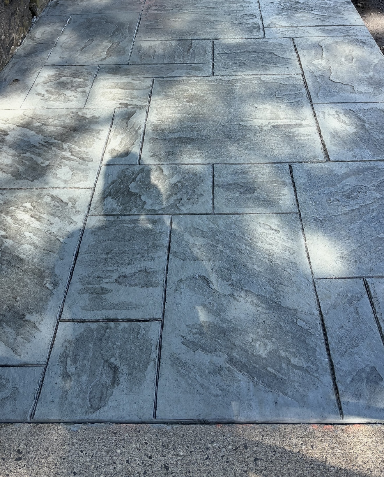 Gray ashlar slate stamped concrete walkway