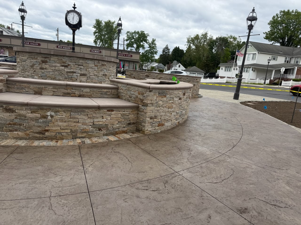 Stamped concrete town plaza with stone seat walls and steps