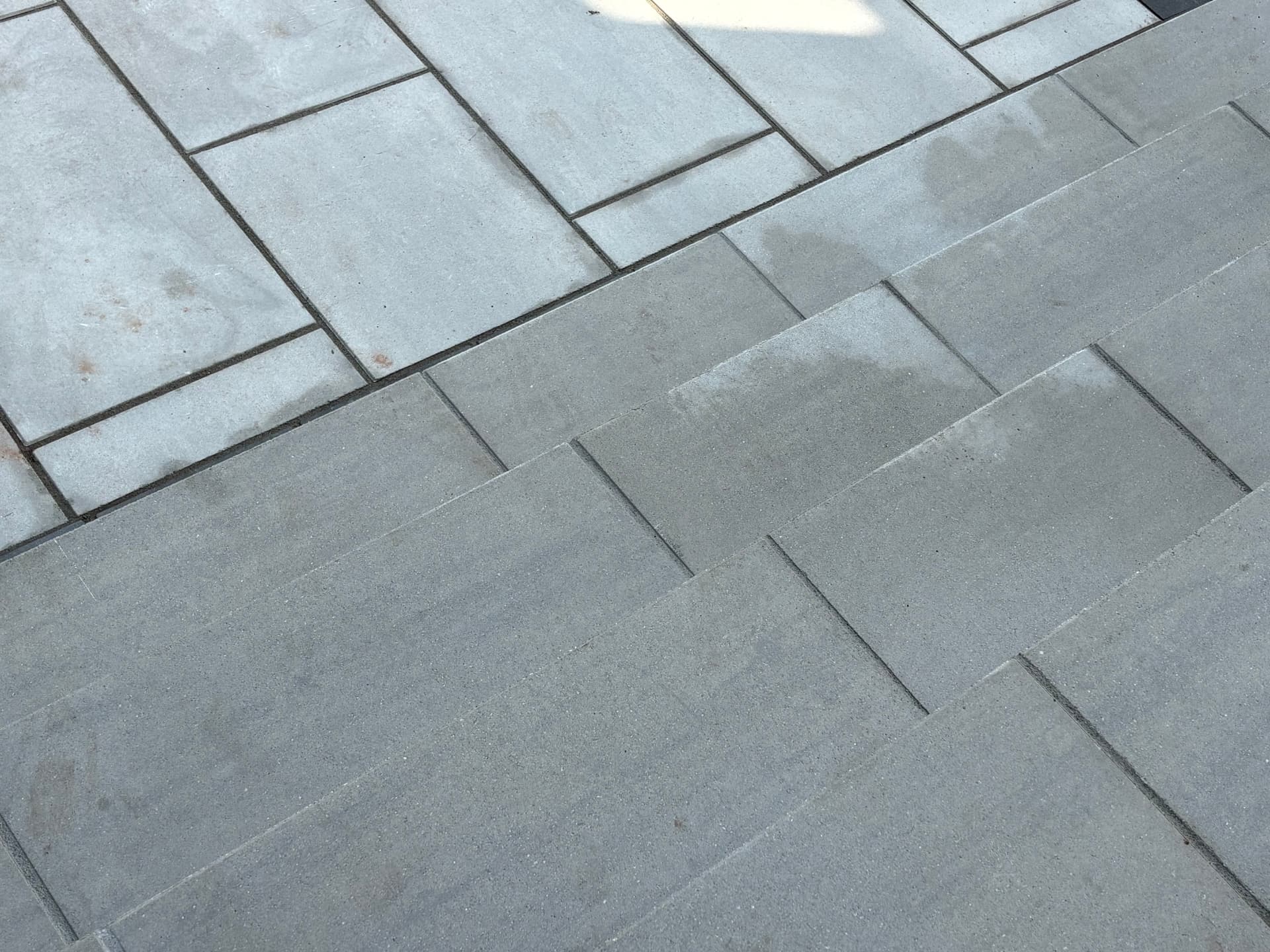 Detail of light and dark bluestone paver banding