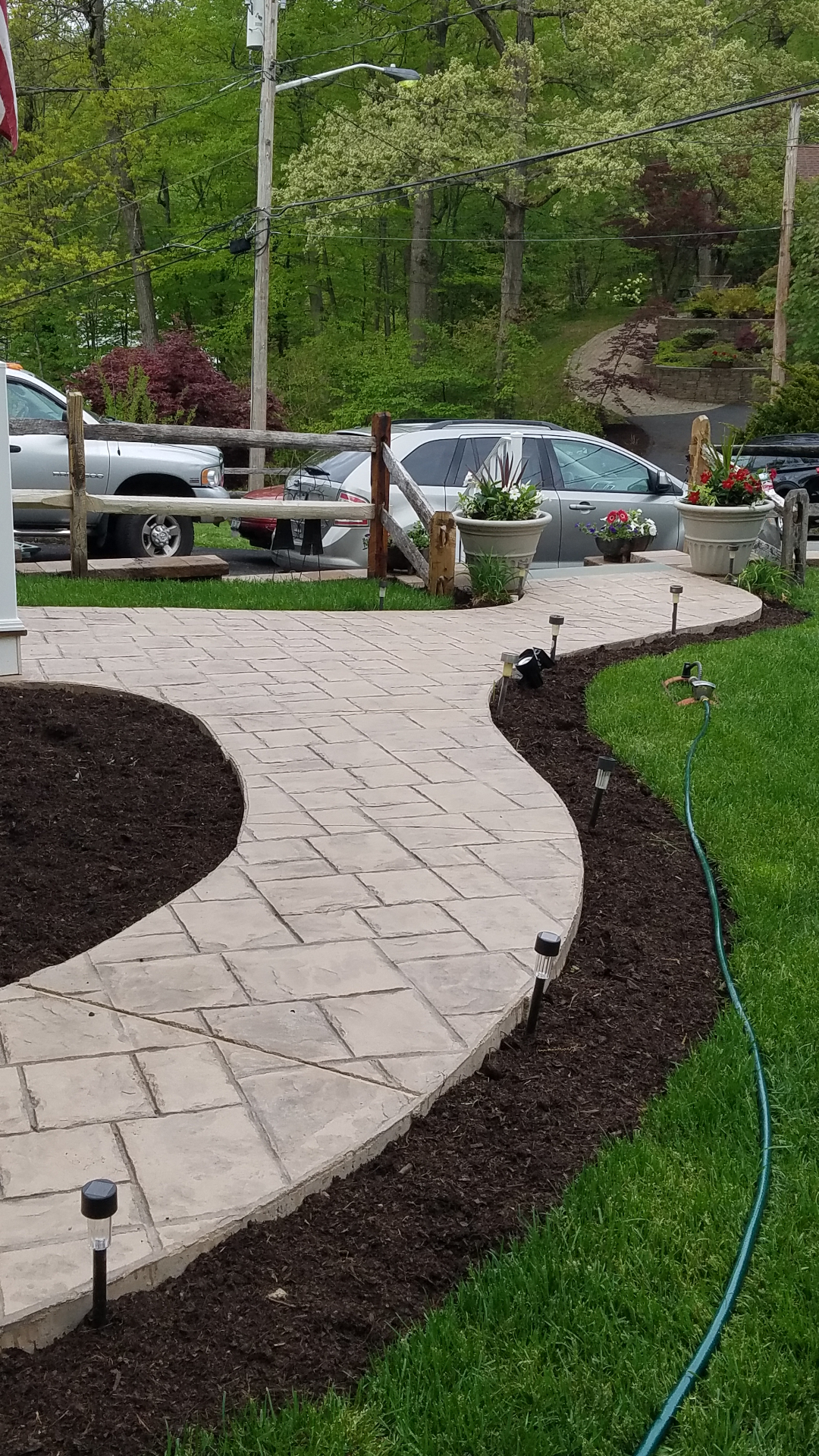 Curved stamped concrete walkway to front porch