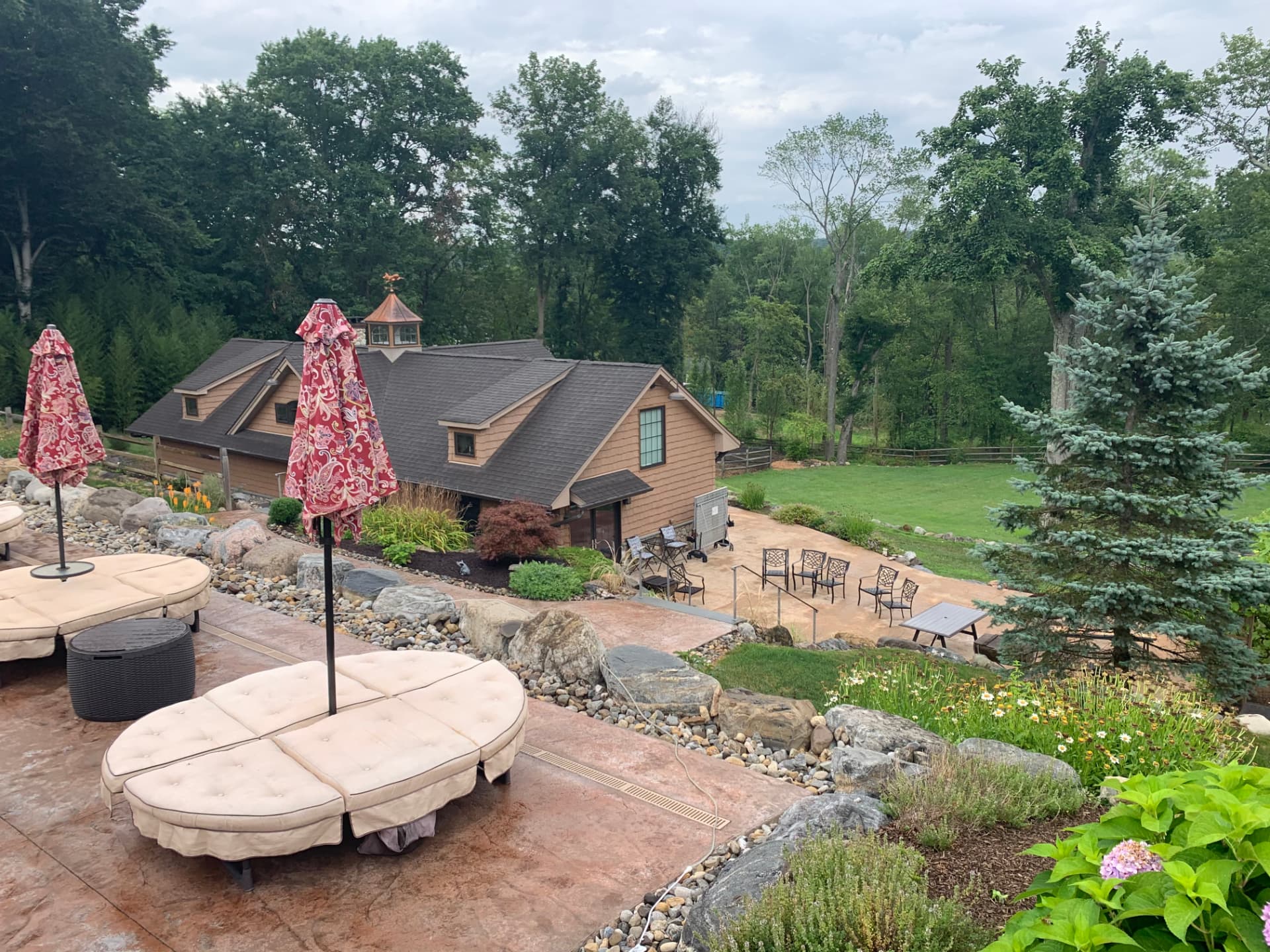Terraced stamped concrete patio overlooking a landscaped yard