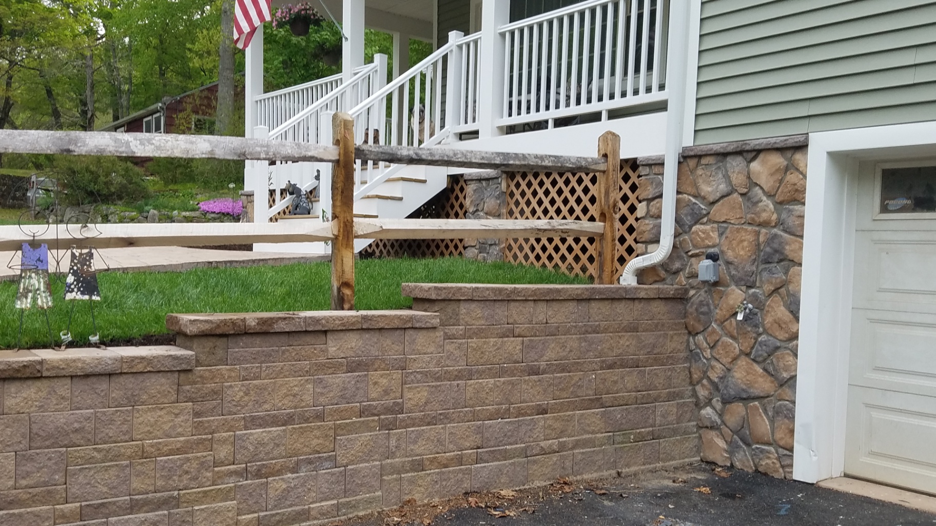 Segmental block retaining wall with stone facade