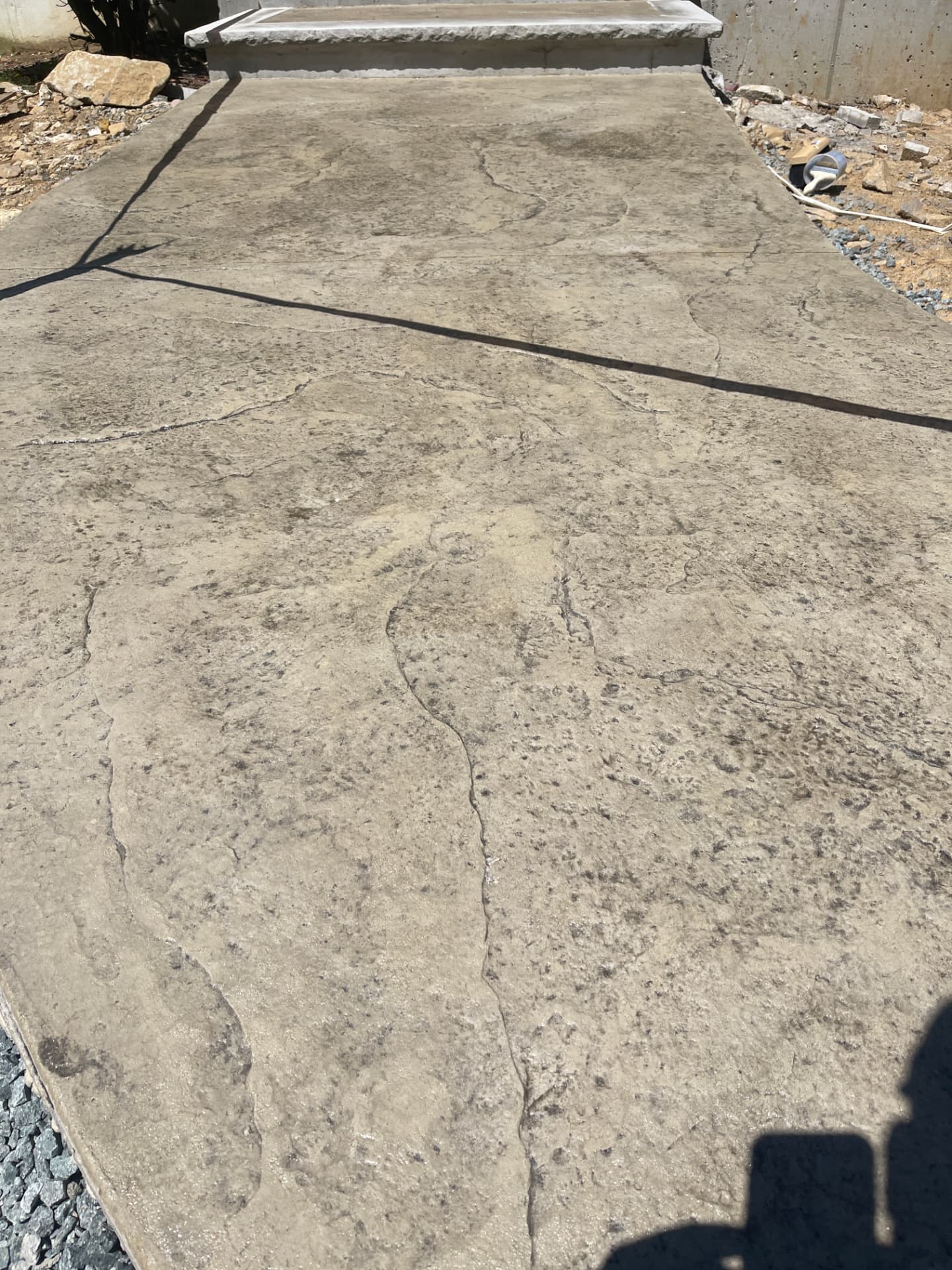 Seamless stone stamped concrete walk with bluestone step